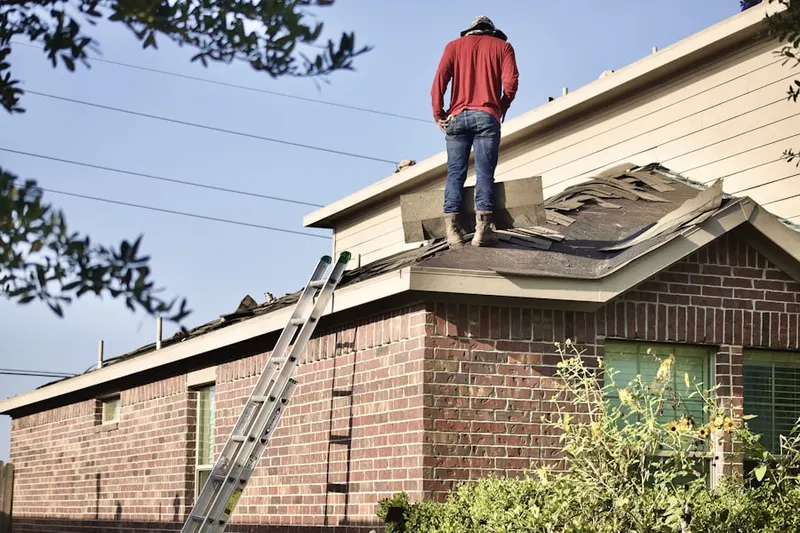 Professional roofer working on a residential roof in Downtown Newnan